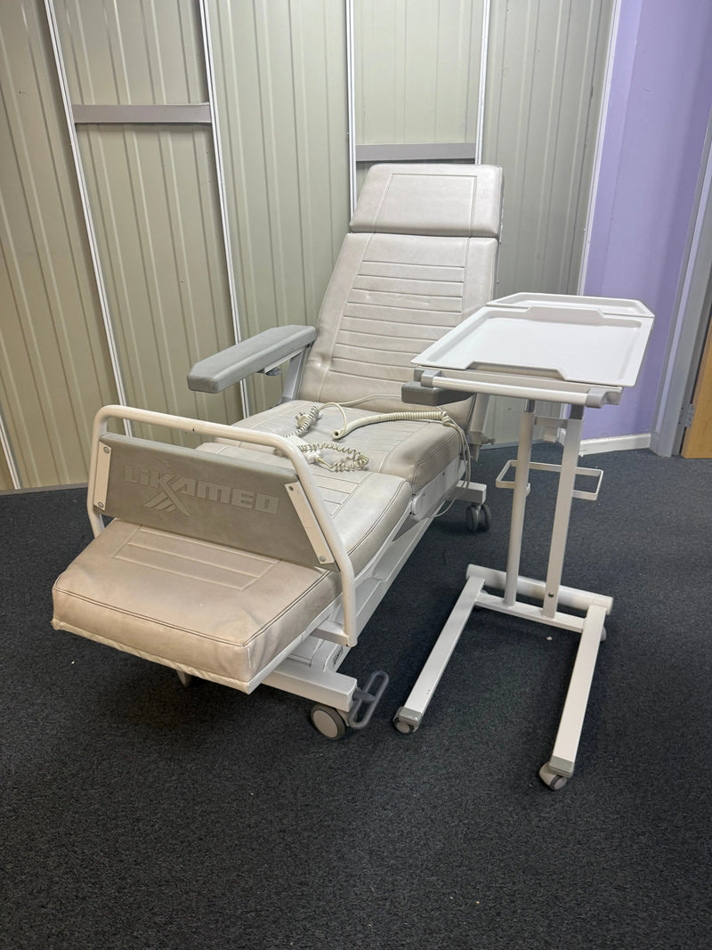 Elevated platform bed with adjustable headboard against a dark wall.