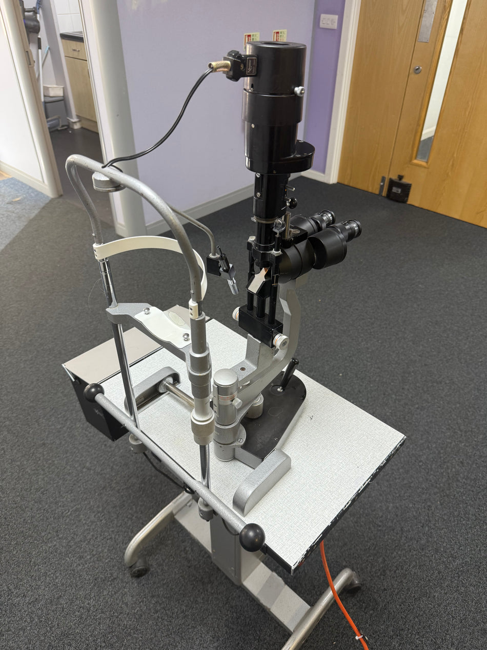Manual ophthalmic table with mounted Mentor slit lamp
