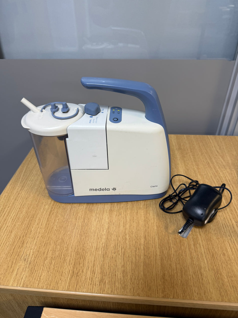 Medela Clario Suction Machine with canister and safety chamber attached
