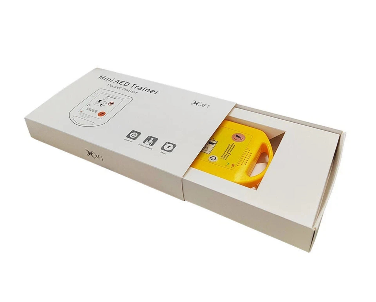 Yellow electronic device in a white box on a white background