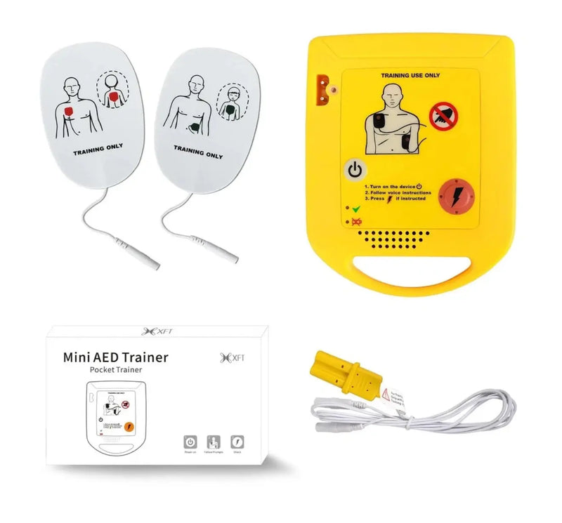 Mini AED Trainer with training pads and packaging on a white background