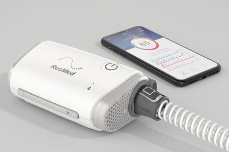 ResMed device with a smartphone displaying app interface on a gray background