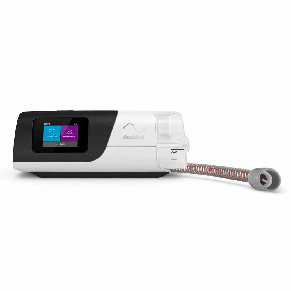 ResMed AirSense 11 CPAP machine with accessories on white background