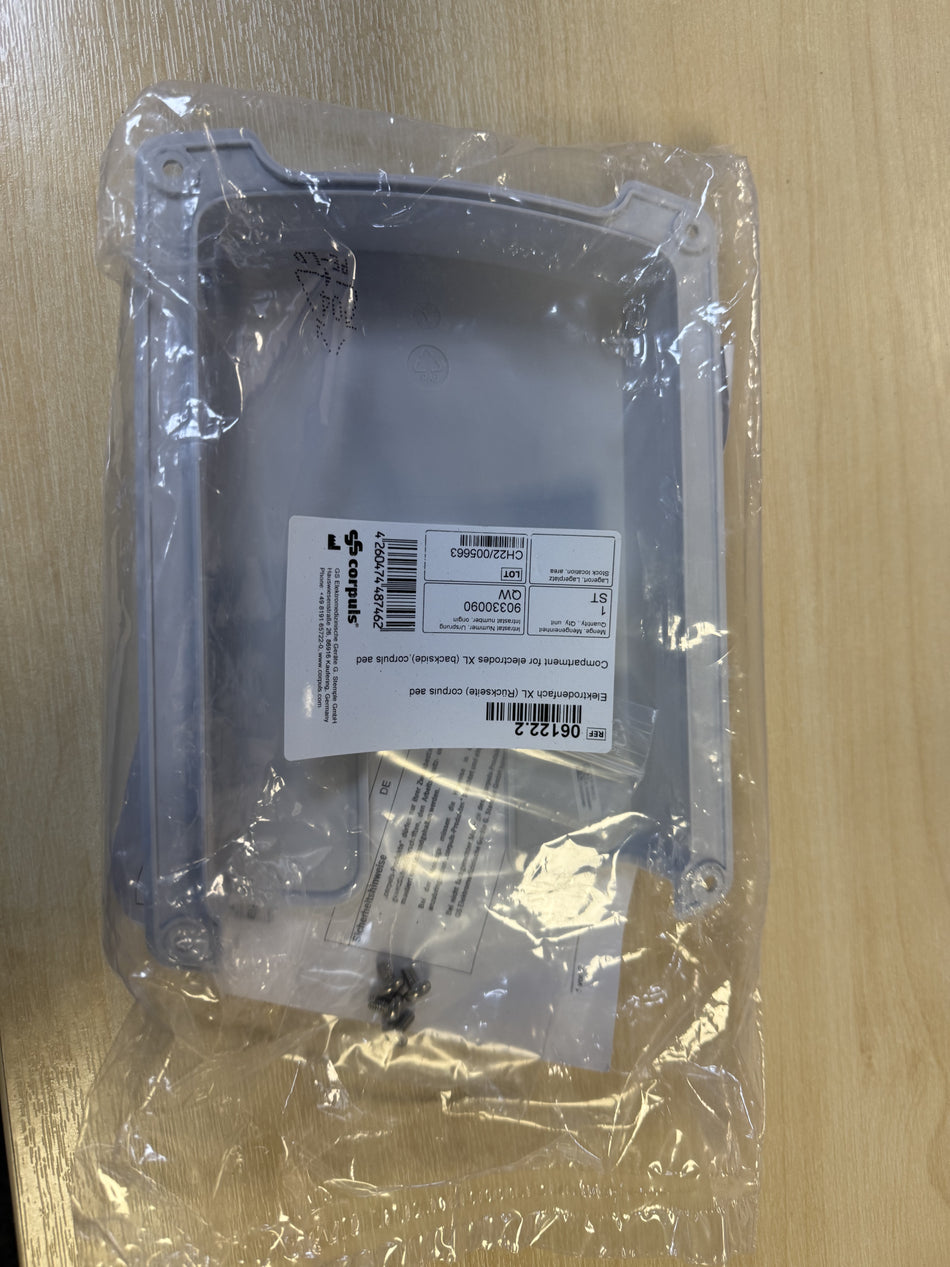 Hard drive in clear plastic packaging on a wooden surface
