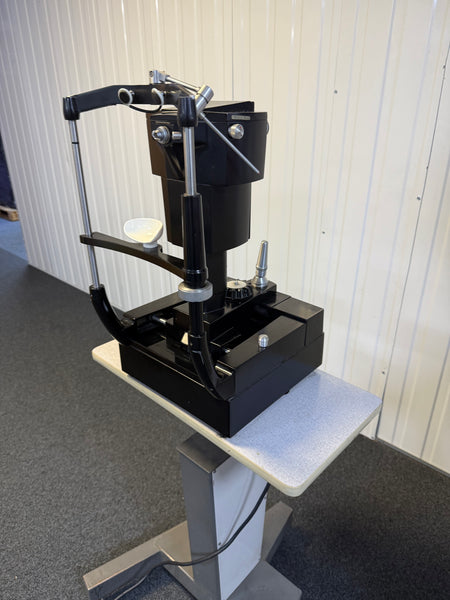 Side view of AO 12415 tonometer mounted on adjustable table