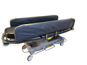 Side view of Anetic Aid QA3 hydraulic Patient Trolley with side rail covers