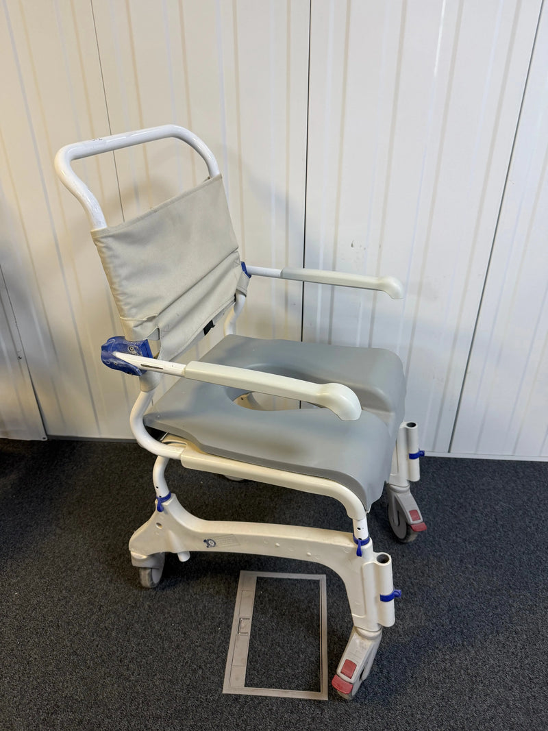 Side view of Aquatec Ocean Ergo XL Shower Commode Chair showcasing stainless steel frame