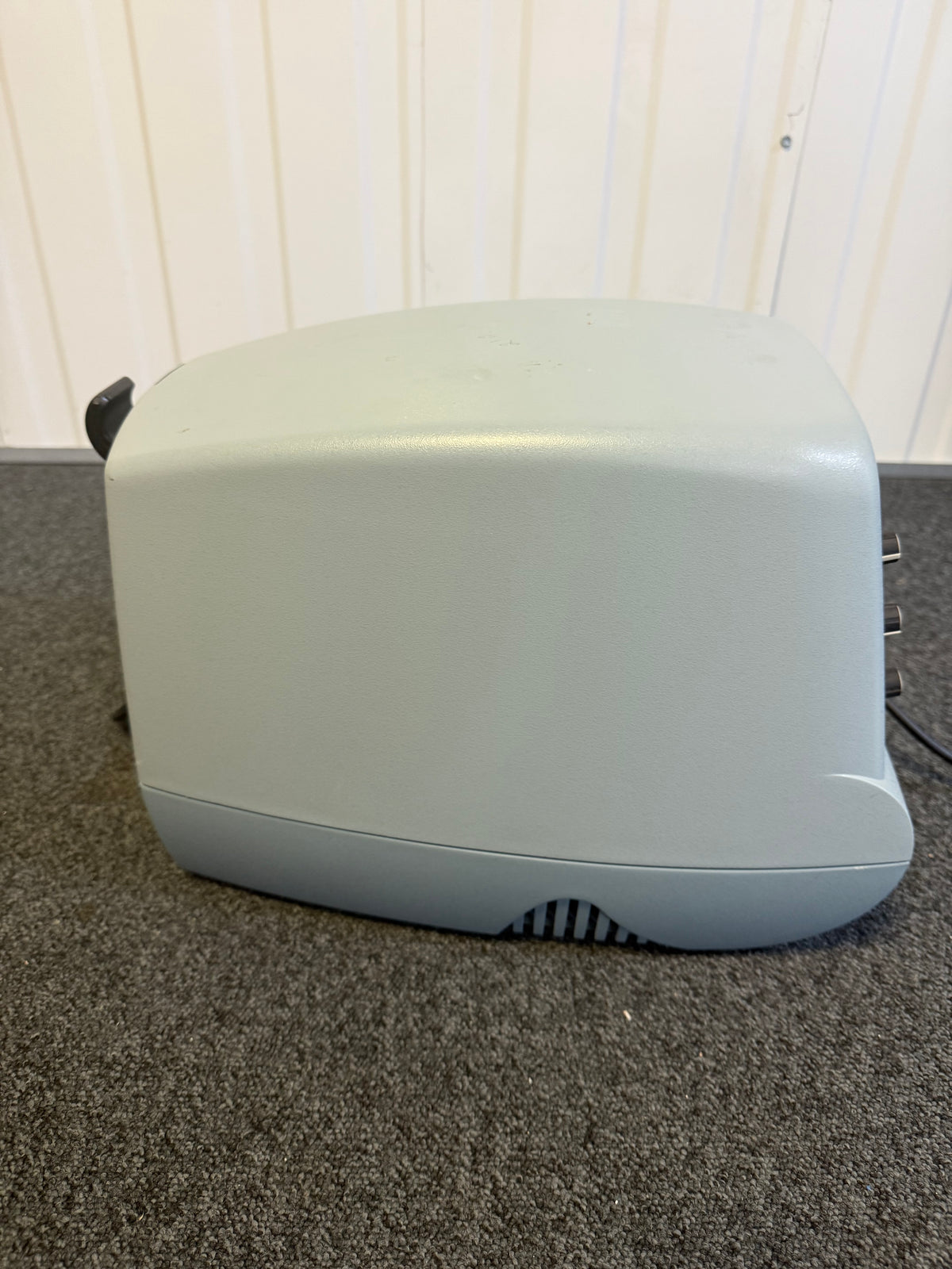 Side view of CoughAssist device on mobile trolley