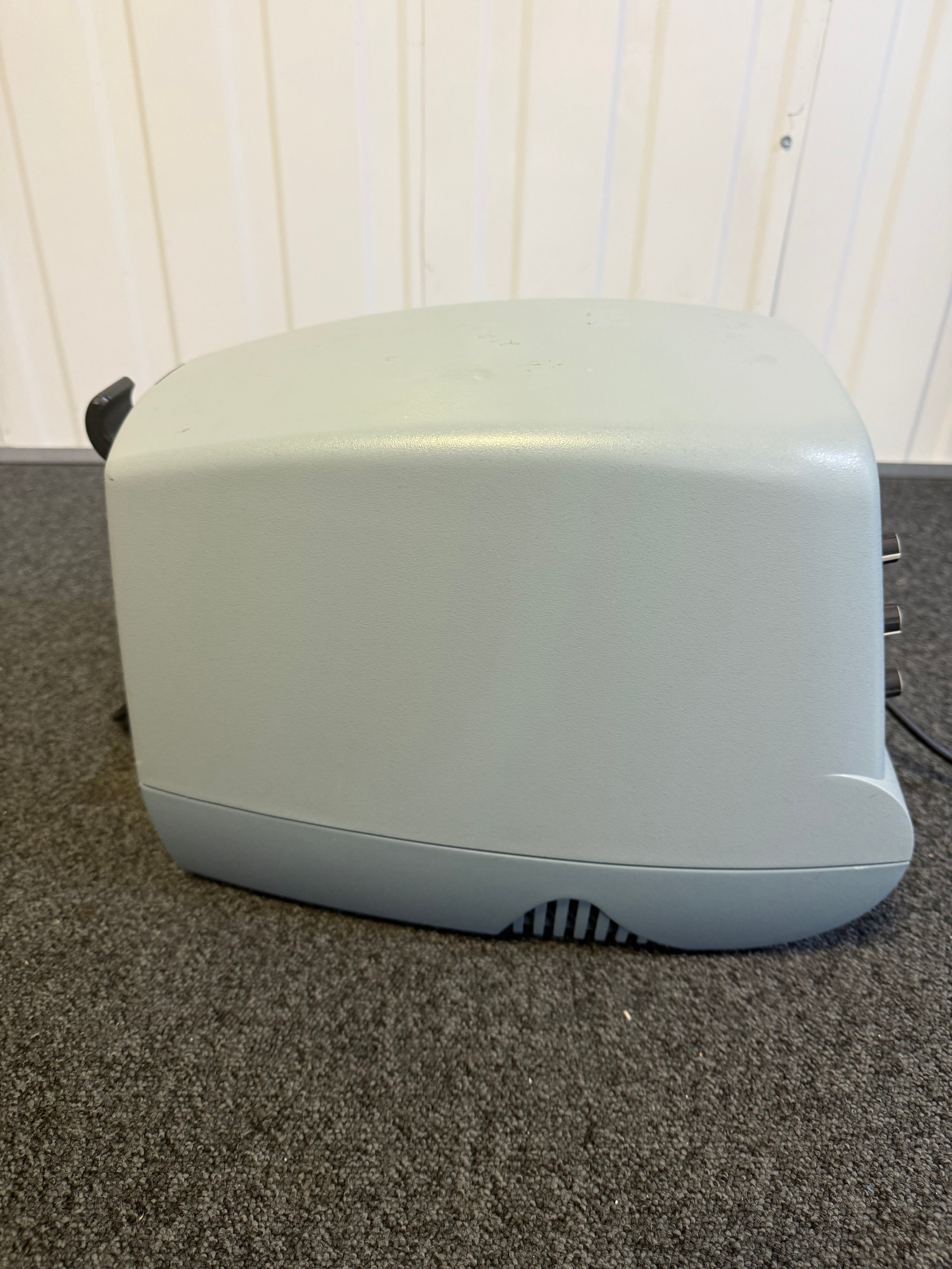 Side view of CoughAssist device on mobile trolley