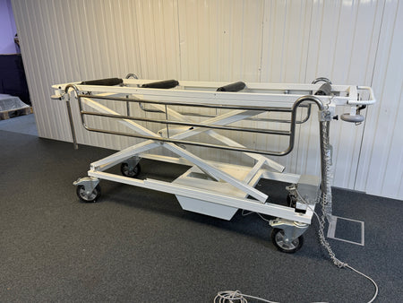 Side view of Electric mortuary table with remote
