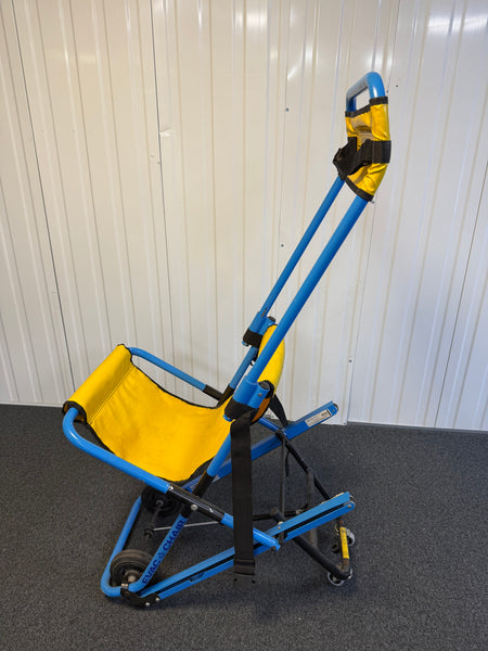 Side view of Evac+Chair MK2 highlighting four-wheel configuration