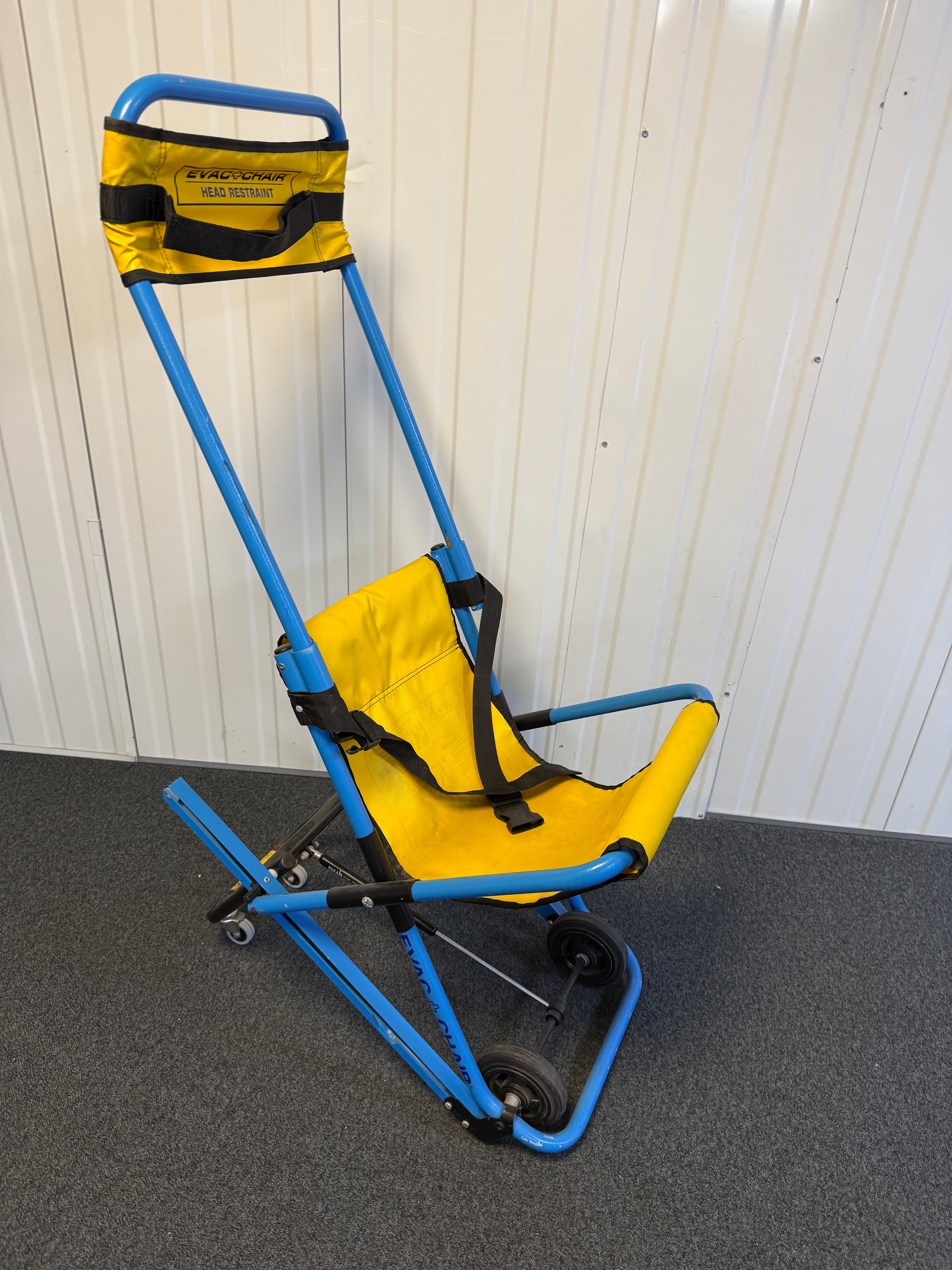 Side view of Evac+Chair MK2 highlighting four-wheel configuration