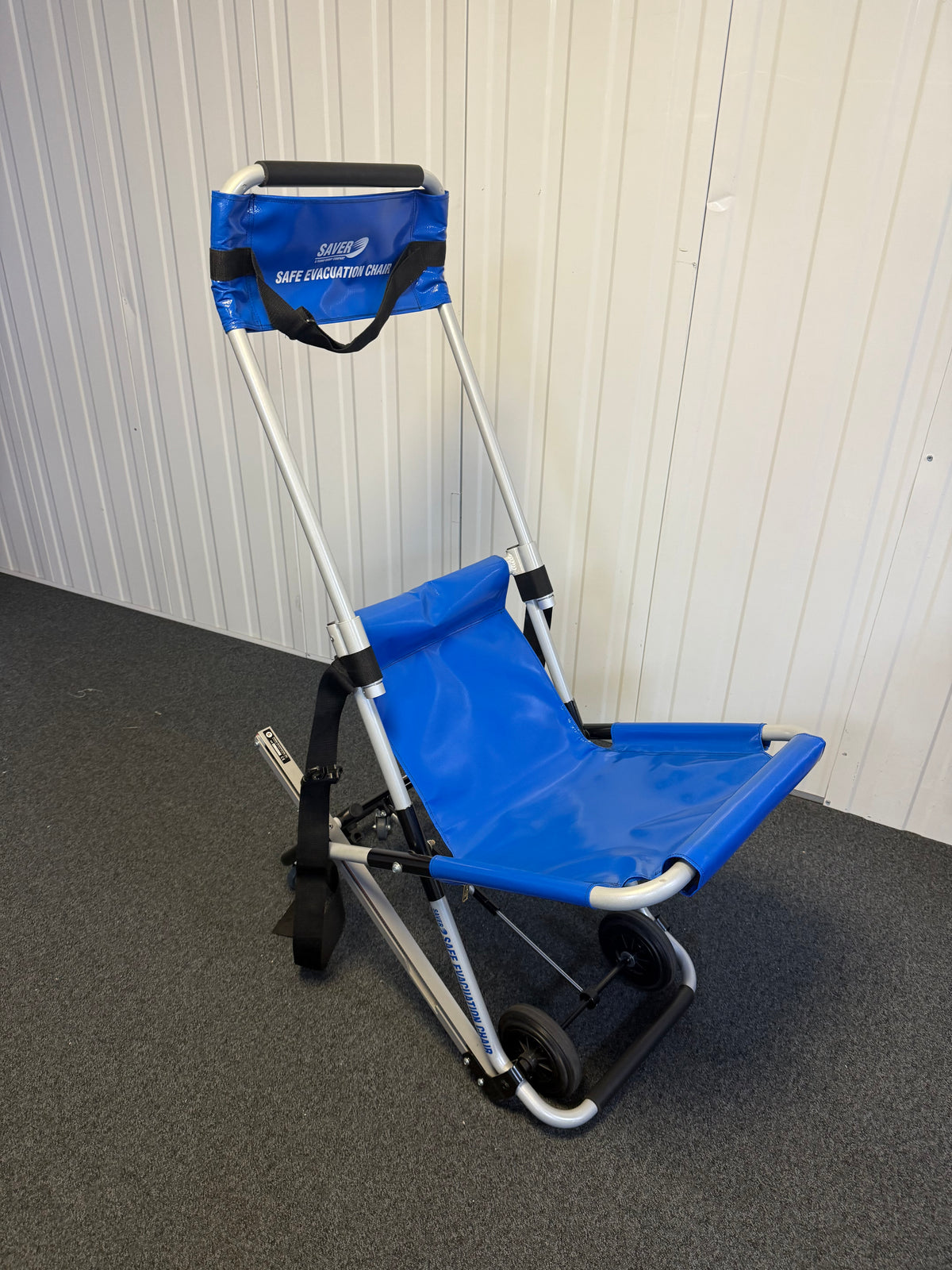 Side view of FERNO evacuation chair showing rubber safety grips