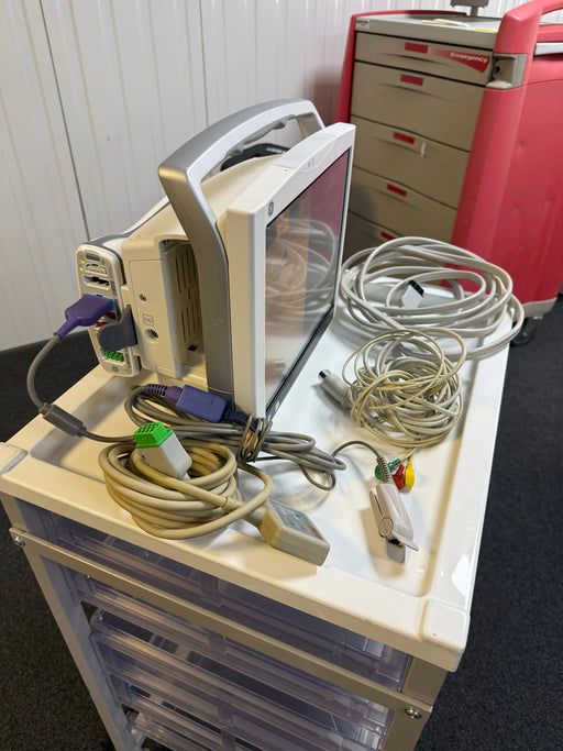 Side view of GE B450 monitor full set with Patient Data Module and accessories