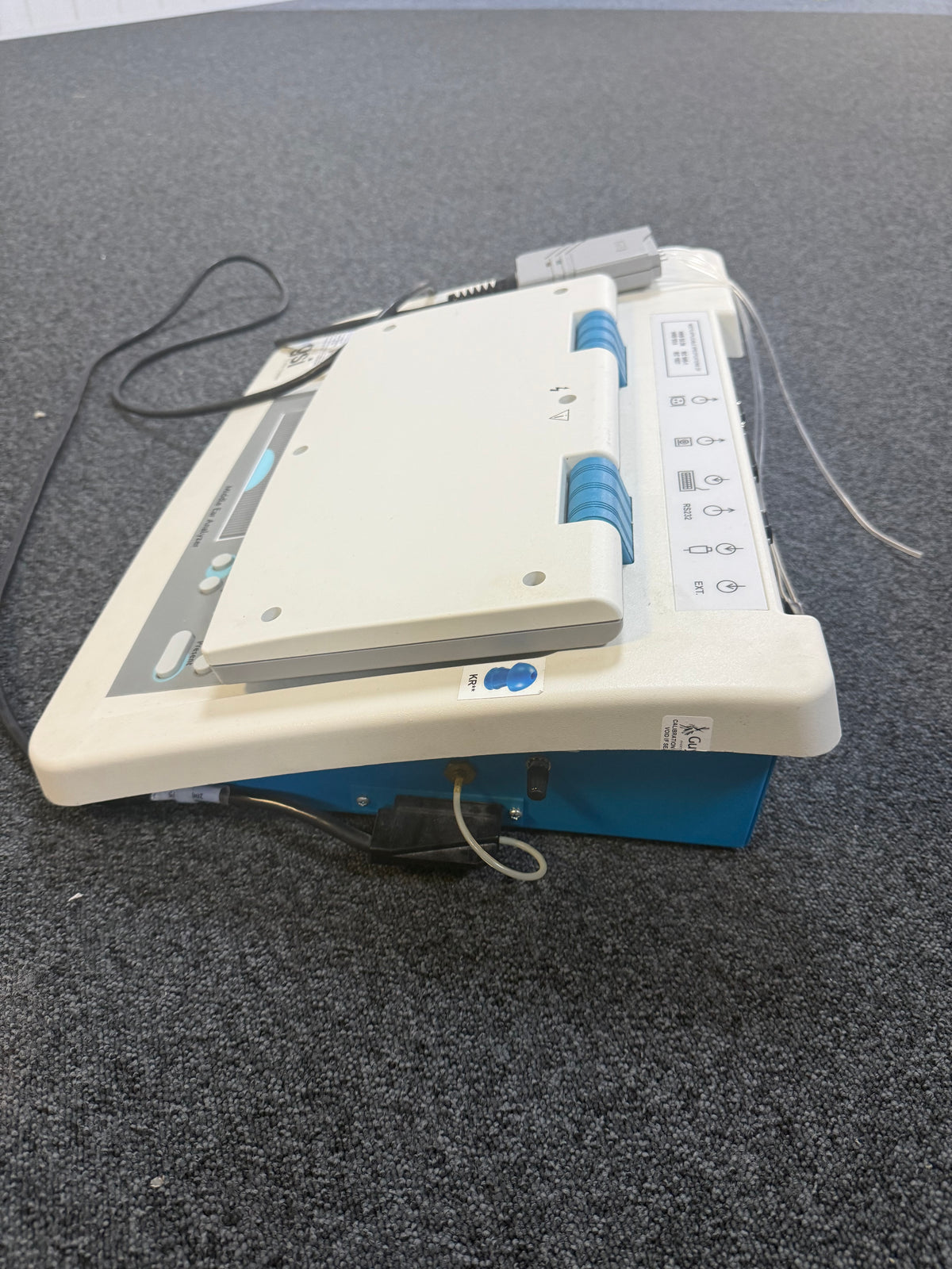 Side view of GSI TympStar with headphone and probe cable