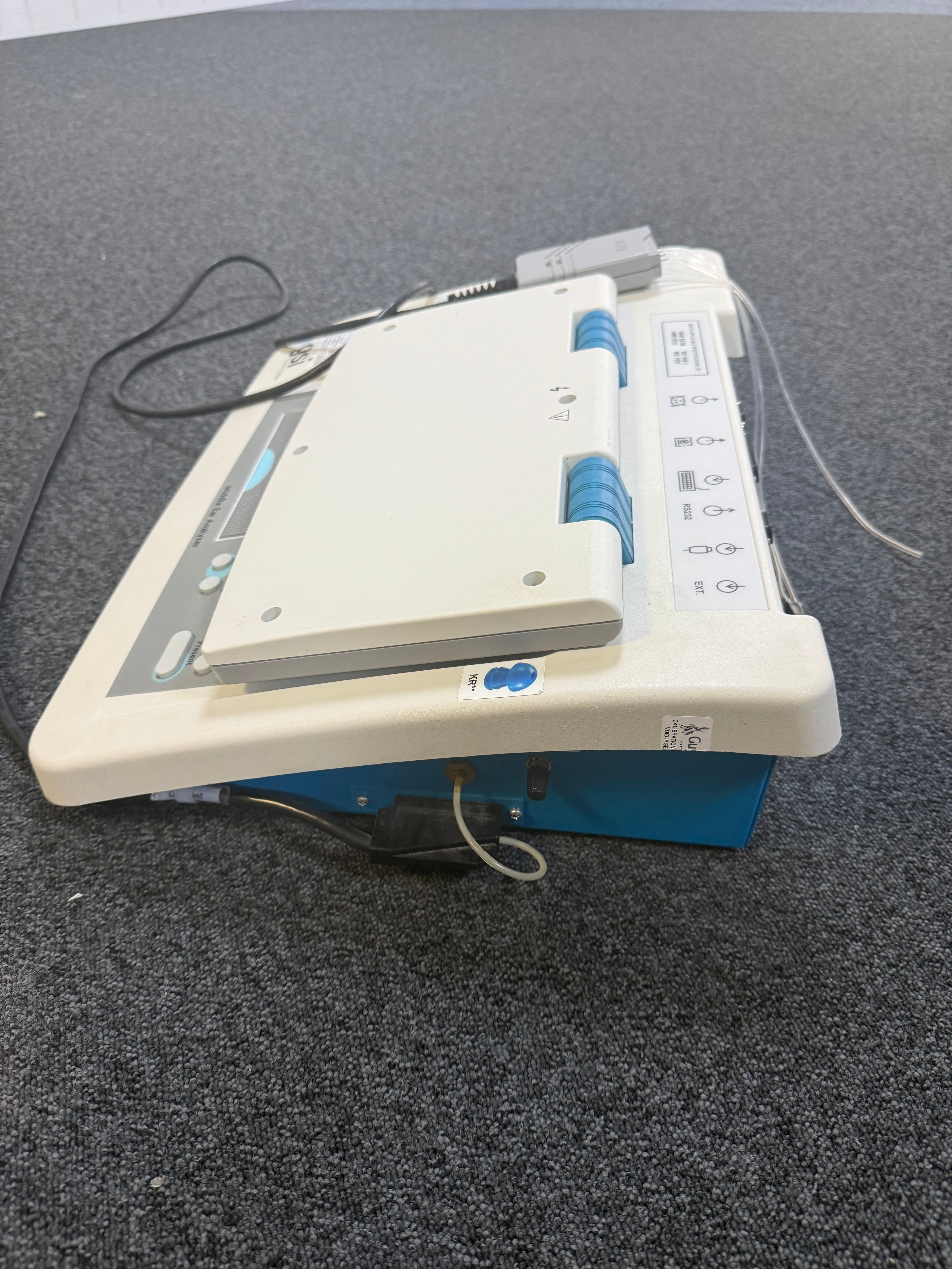 Side view of GSI TympStar with headphone and probe cable