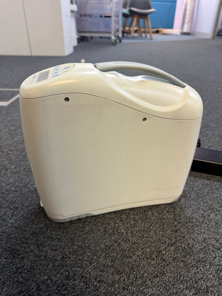 Side view of Inogen G2 unit showing compact size and oxygen ports