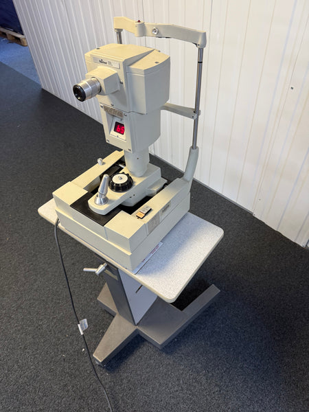 Side view of Reichert 12415 non-contact tonometer with wheeled table