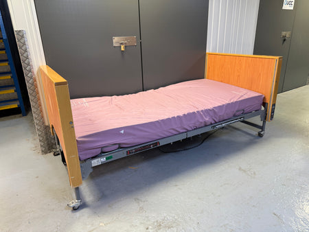 Side view of Woburn Ultra Low electric bed with handset