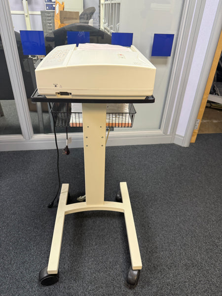 Side view of the Seca CT6i desktop ECG device with patient cable in a stand