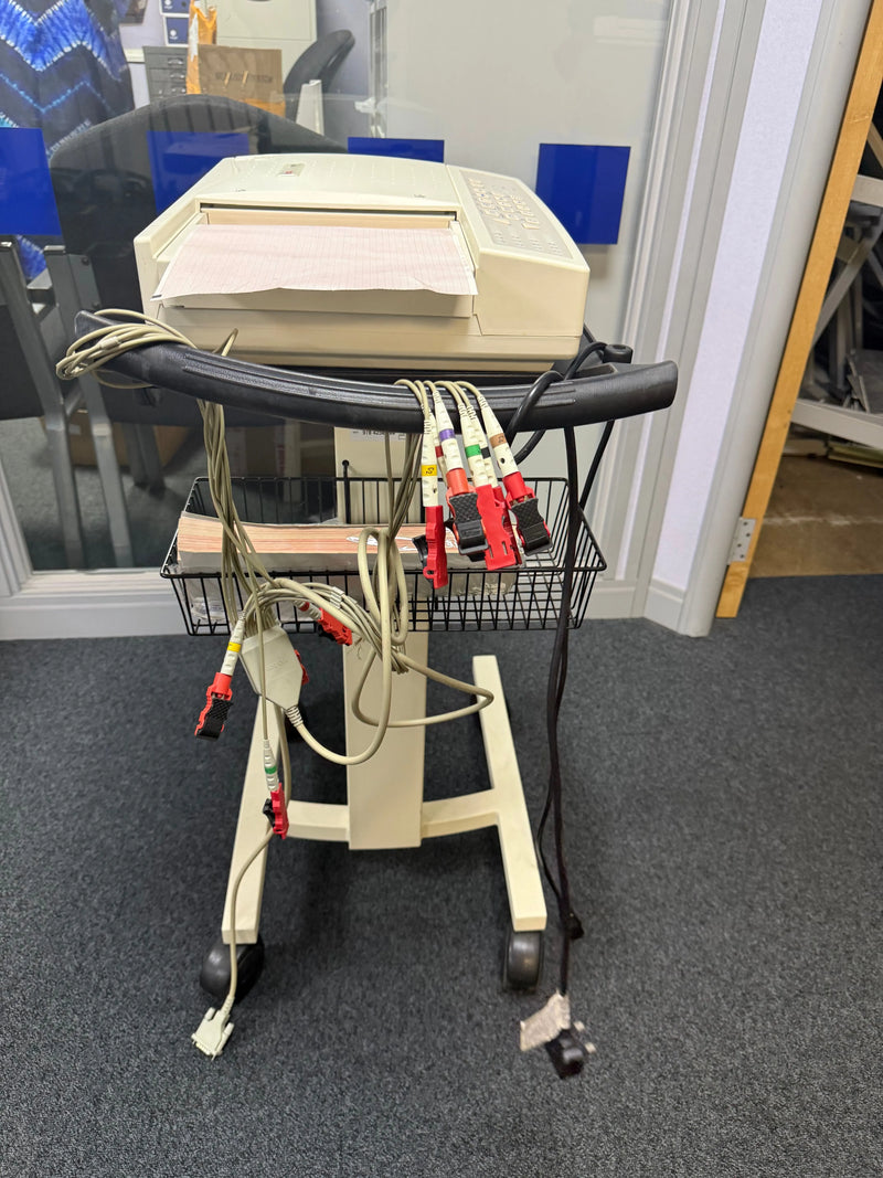 Side view of the Seca CT6i desktop ECG device with patient cable in a stand