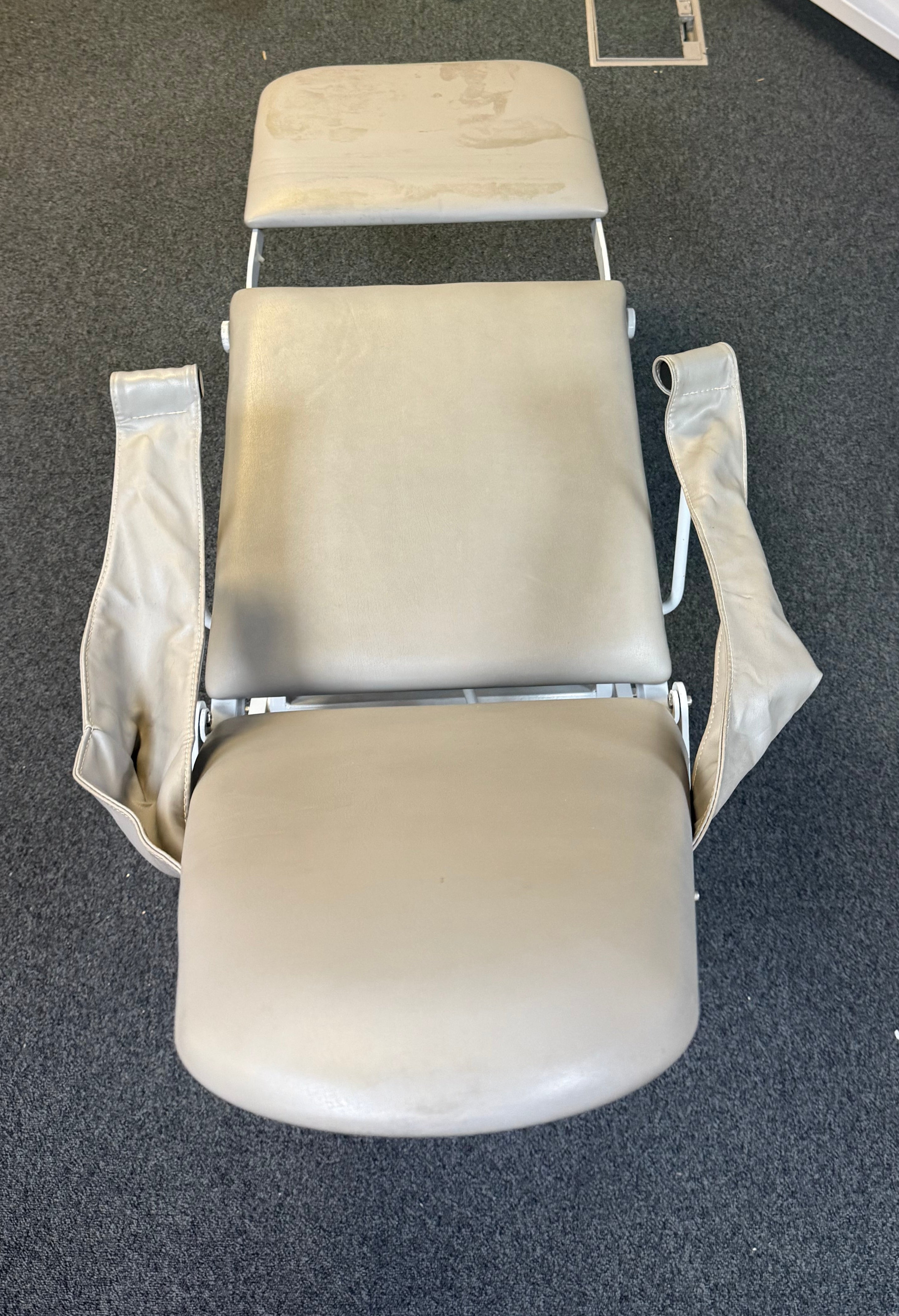 Top view of A-Dec chair showing hinge mechanism