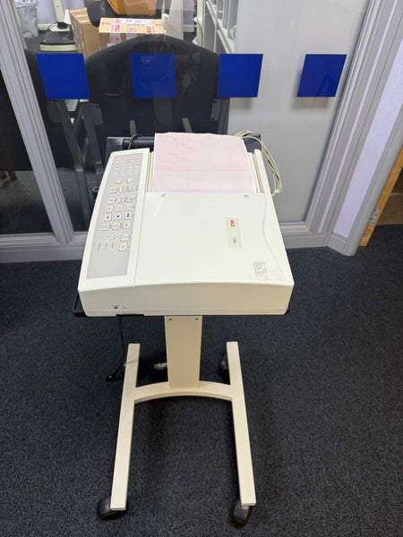 Top view of the Seca CT6i desktop ECG device with ECG Leadsin a stand