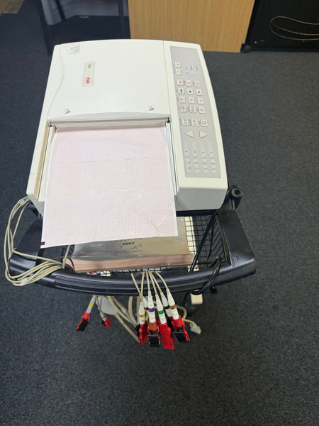 Top view of the Seca CT6i desktop ECG device with ECG Leadsin a stand