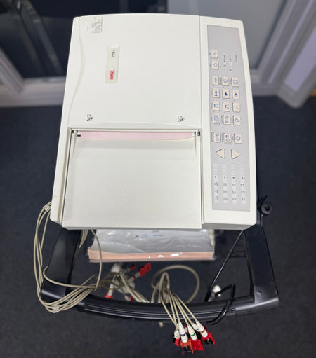 Top  view of the Seca CT6i desktop ECG device with patient cable in a stand