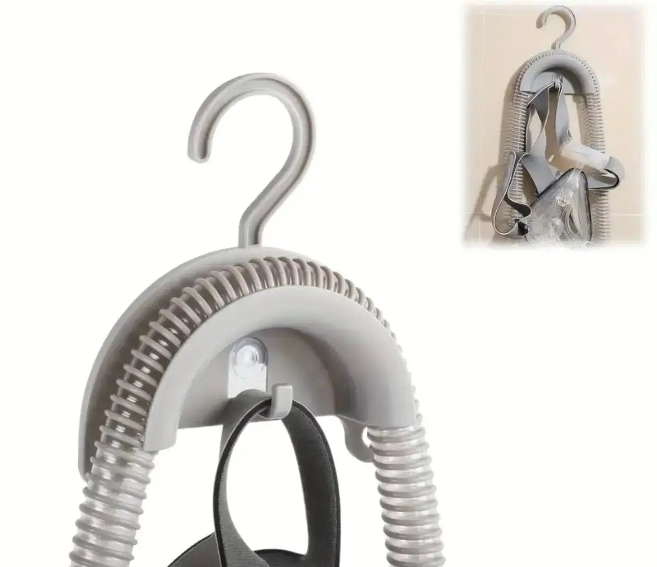 Gray hanger with spring mechanism on a white background