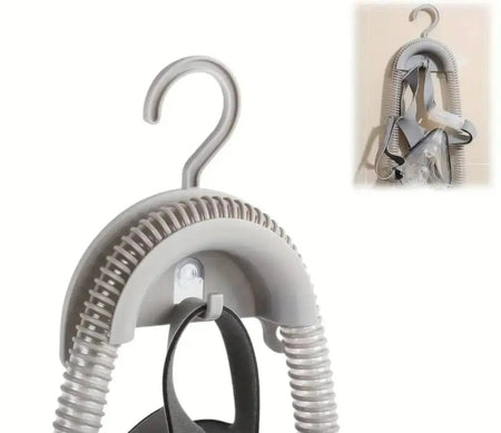Gray hanger with spring mechanism on a white background