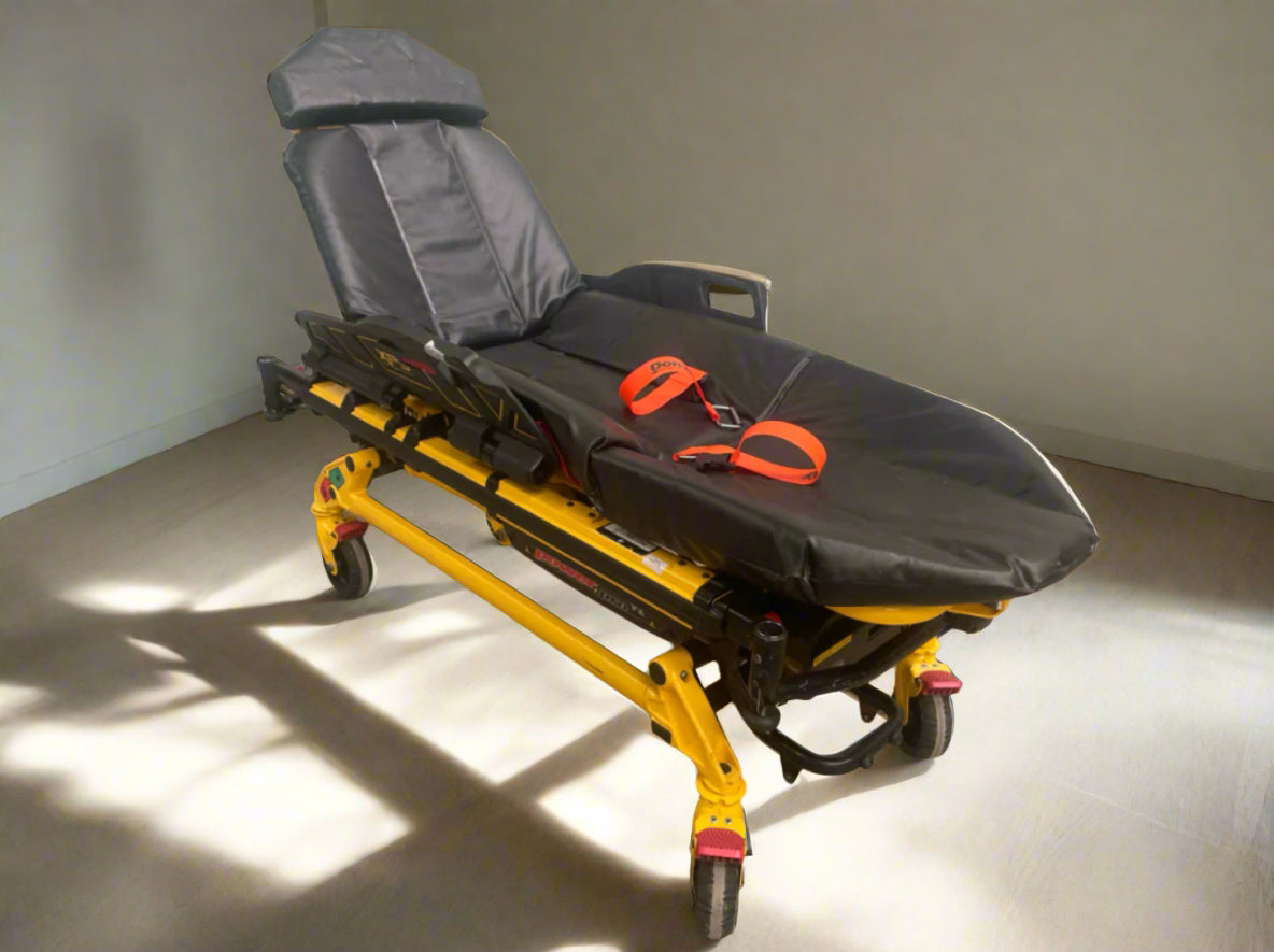 Used Stryker stretcher package including mattress, straps, battery, and charger