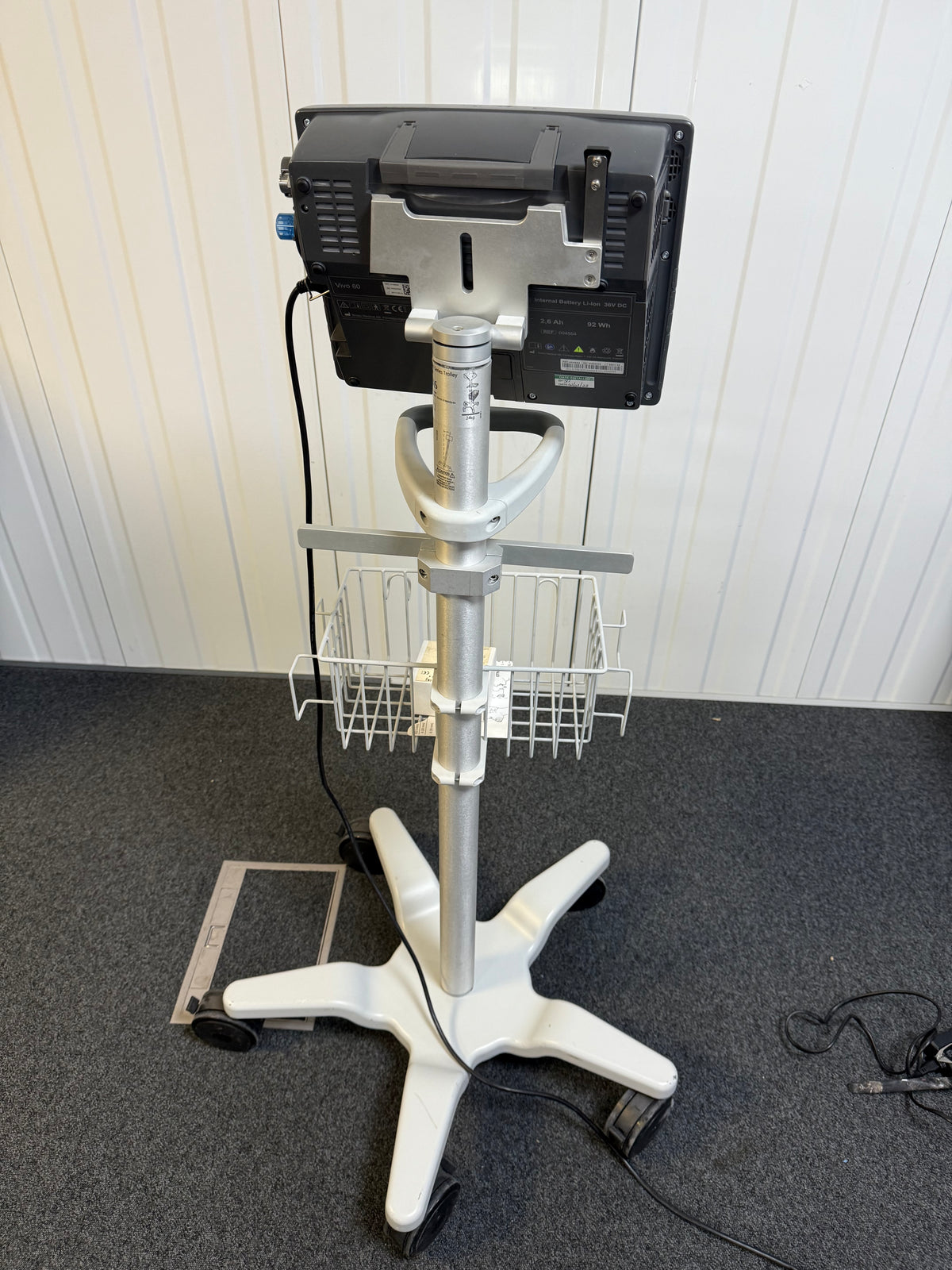 Back view of Vivo 60 life-support ventilator with protective cover and rollstand
