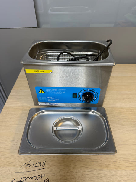 Walker Electronics QC Ultrasonic Cleaner in use, effectively cleaning dental instruments