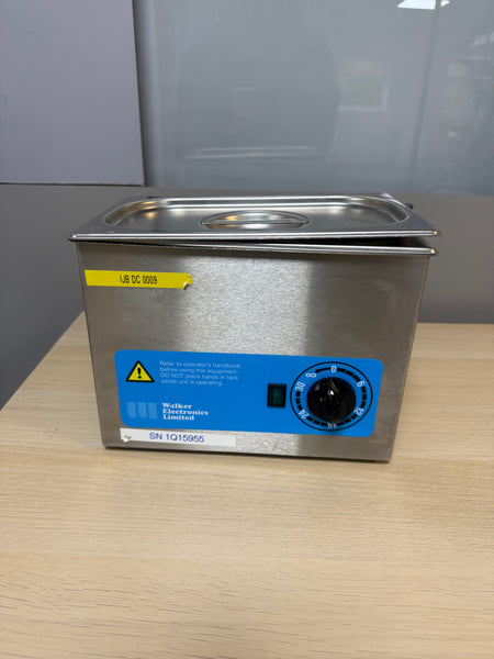 Walker Electronics QC Ultrasonic Cleaner in use, effectively cleaning dental instruments