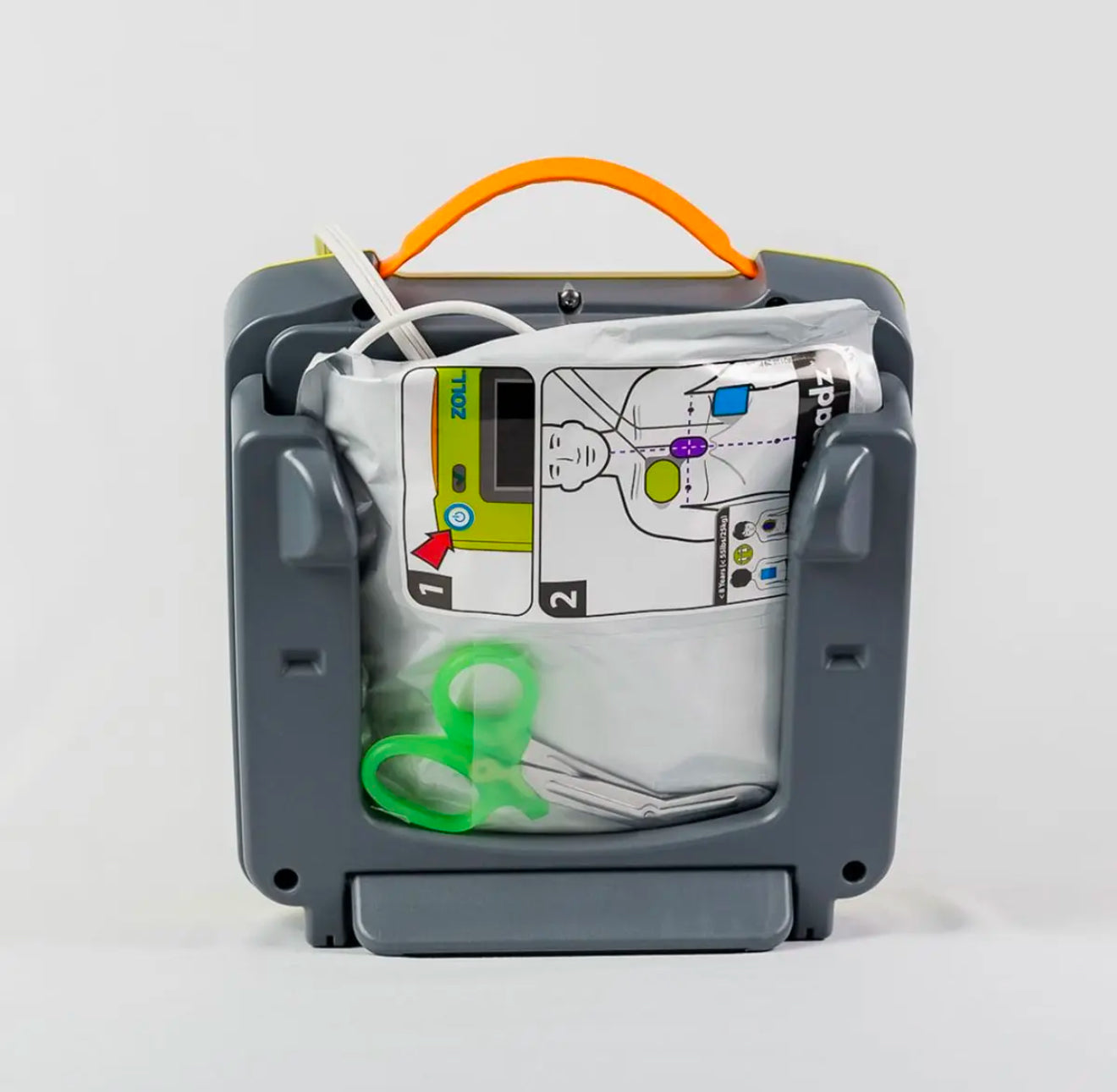A medical device with a gray casing, orange handle, and various components on a white background.