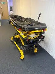 Used Stryker stretcher package including mattress, straps, battery, and charger