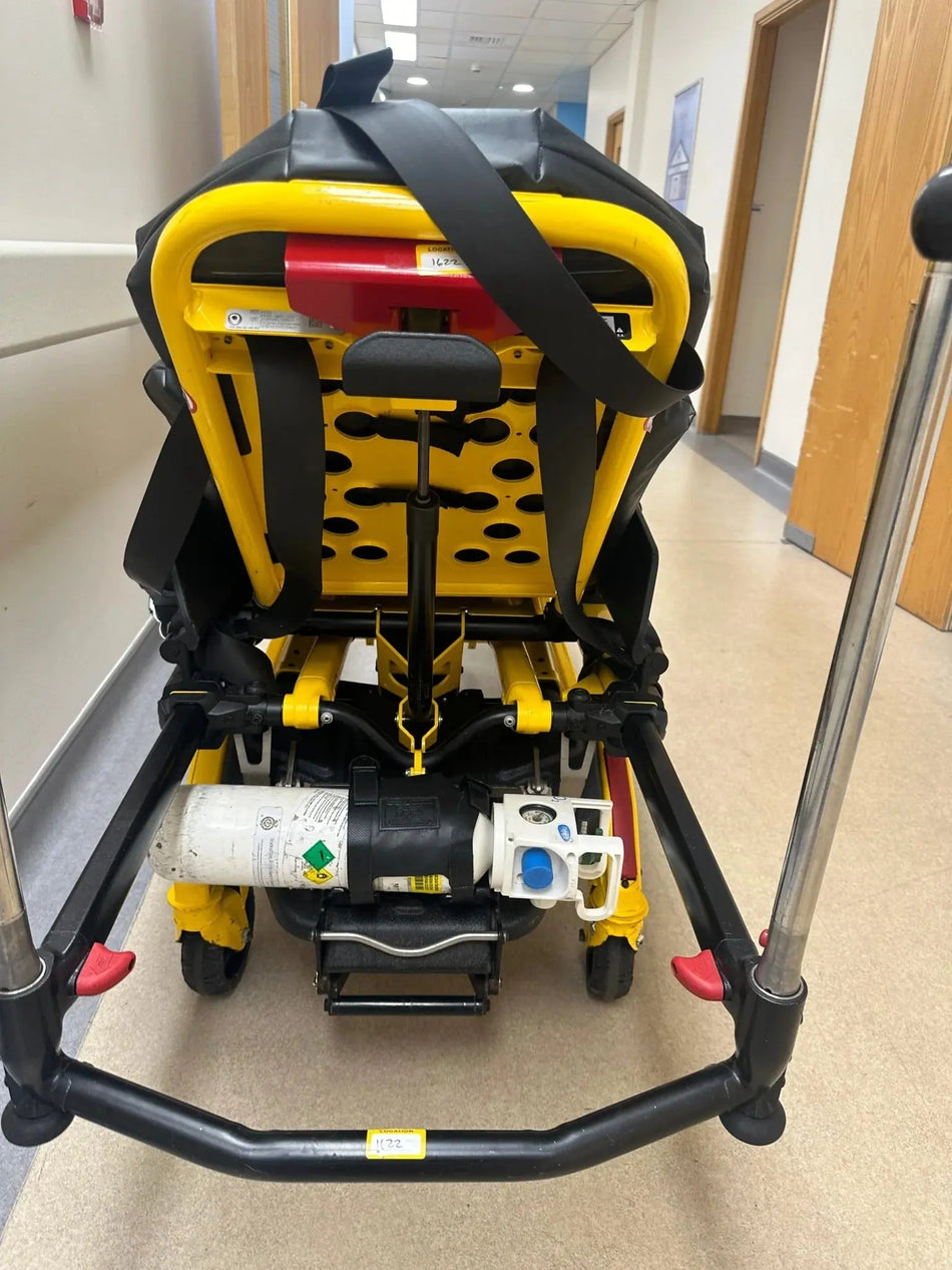 Used Stryker stretcher package including mattress, straps, battery, and charger